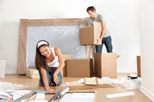 A removals team handling flat moving preparations in West Kensington