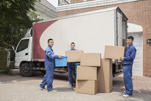 Local removals team loading office items for transport