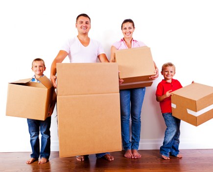 Unpacking service helping a family settle into a West Kensington property