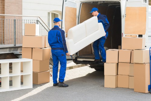 Removal team planning a move in West Kensington street with apartment access