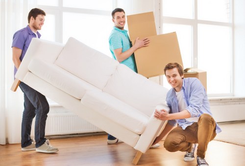 Preparing household items and labels for a move in West Kensington