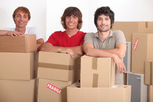 Student removals team loading boxes and furniture in West Kensington