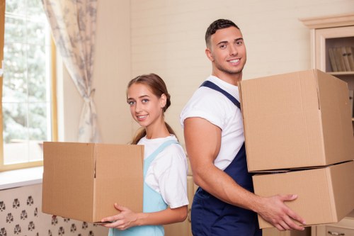 Careful loading of wardrobes and tables during a West Kensington furniture pick-up